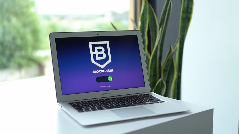 A plain desk with a laptop, the kind of quiet workspace used for hardware wallet setup